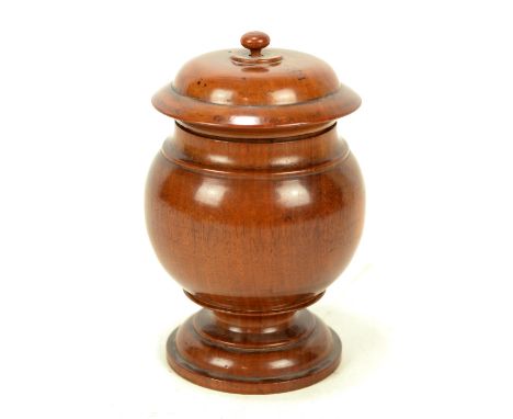 A 19th century turned walnut tobacco jar and cover, with ring turned base and knopped finial, height 18.5cm. CONDITION REPORT