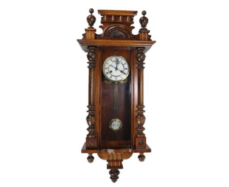 A circa 1900 stained beech and walnut spring driven Vienna style wall clock, length approx 90cm. CONDITION REPORT: This lot h