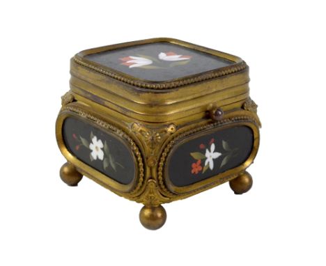 A late 19th century gilt metal and pietra dura hardstone set trinket box of rounded square form, the lid decorated with two f