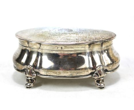 DEAKIN &amp; FRANCIS; a George V hallmarked silver shaped oval jewellery box with fluted corners and hinged engine turned dec