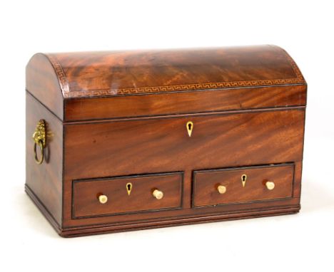 A Victorian mahogany dome topped sewing box, the hinged lid with Greek key inlaid border enclosing a fabric lined interior wi