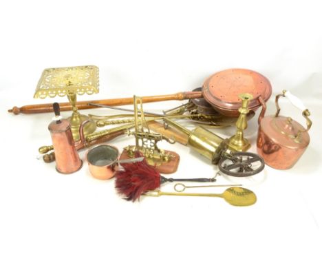 A quantity of metalware including a brass spit, trivet, wall mounted bracket, warming pan, chestnut roaster, etc.