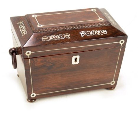 An early Victorian rosewood and mother of pearl inlaid tea caddy of sarcophagus form, the hinged lid enclosing two rosewood l