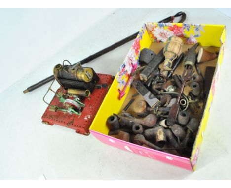 A group of vintage pipes and a stationary engine (af).