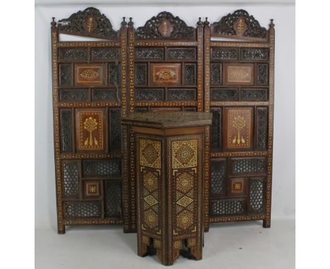 An Indian pierced and inlaid three panel screen (af) and a small Moorish table (2). CONDITION REPORT: One of the upper sectio