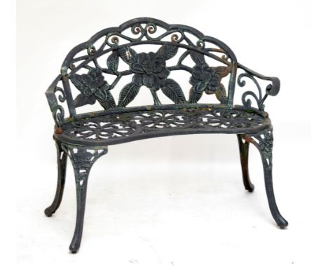 A small floral motif cast iron garden bench, width 102.5cm.