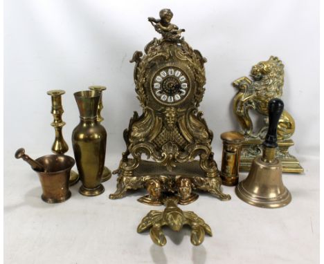 A small group of brassware including lobster, pair of candlesticks, bell etc, also an elaborate mantel clock with cherub fini