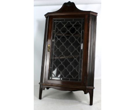 A mahogany corner cupboard with glazed door enclosing two shelves, width 51cm. CONDITION REPORT: Lower shelf is skewed and wi