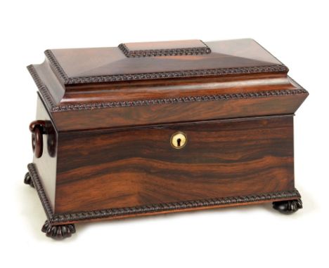 An early Victorian rosewood tea caddy of sarcophagus form, the hinged lid enclosing two rosewood veneered lidded tea boxes, c