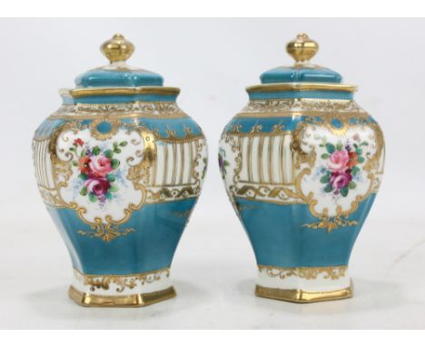 A pair of Noritake hexagonal baluster vases with gilt heightened decoration on turquoise ground, height 15cm (one af). CONDIT