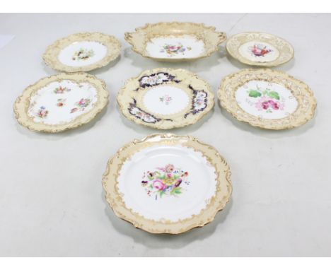 Seven Coalport floral painted cabinet plates and dishes (including one teapot stand), each with pale yellow/cream gilt height