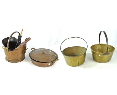 A group of metalware to include two brass jam pans, a copper example with cover and a pair of fire place companion tools.