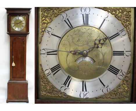 A late 18th century thirty hour oak longcase clock, with 12" brass dial inscribed 'Thos Ward, Wrexham', above long arched doo