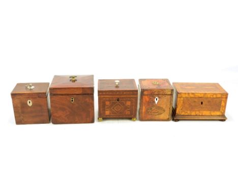 A late George III mahogany and inlaid square sectioned tea caddy having the unusual feature of turned wooden mouldings to the