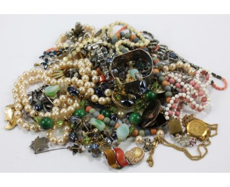 A mixed lot of costume jewellery including faux pearl and bead necklaces, enamelled brooches, necklaces etc and also a hallma