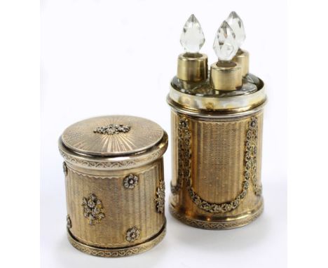 ANTHON SALOMON; an early 20th century French silver gilt cylindrical scent bottle case with overall engine turned decoration 