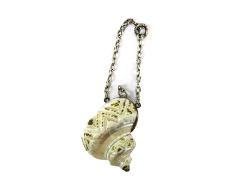 A Victorian white metal mounted carved shell snuff box with hinged lid and suspension ring, apparently unmarked, length of bo