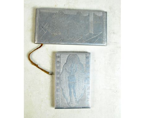 Two mid-20th century prisoner-of-war metal cigarette cases, both with carved decoration throughout, the first and smaller wit