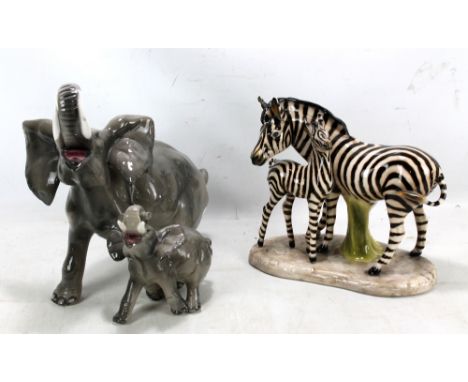 An Italian ceramic figure group of zebra (af) and young stamped Cocchetto (possibly) to base, and a similar unmarked elephant