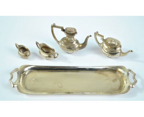 P H VOGEL &amp; CO; an Elizabeth II hallmarked silver miniature five piece tea set with part gadrooned decoration comprising 