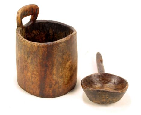 A 19th century stained beech grain bucket and ladle, the bucket with integral carrying handle and crimped decoration to the r