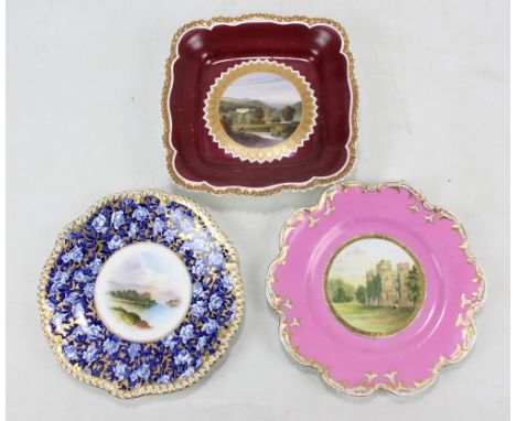 A Coalport hand painted and printed cabinet plate centred with a view of 'Kilchurn Castle' by Perry, with a blue and white ro