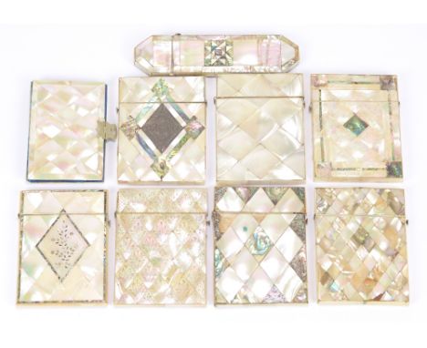 Seven Victorian mother of pearl set card cases, a similar case for a pair of spectacles, and a purse with concertina action c