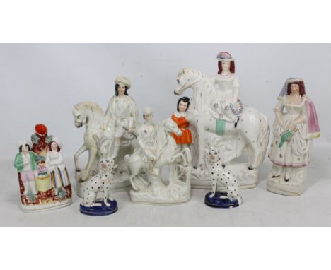 A group of Staffordshire figures including a pair of Dalmatians and a figural spill vase (several items af). CONDITION REPORT
