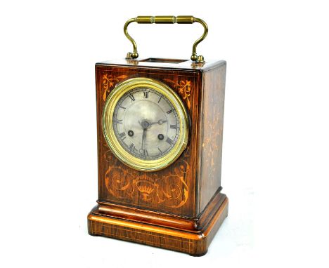 An Edwardian rosewood and inlaid mantel clock on the form of an oversized carriage clock, with brass swing handle, silvered d
