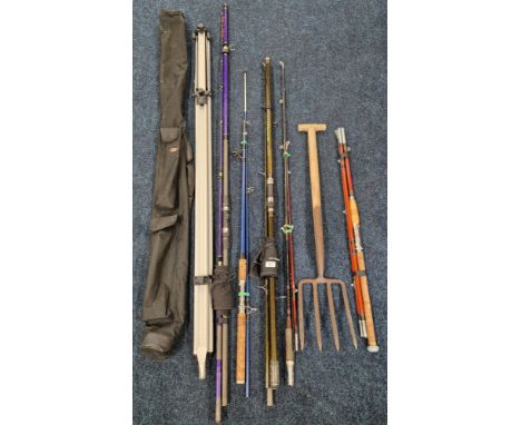 A collection of various fishing rods &amp; fishing stand together with bait fork;  Abu Garcia fishing rod, Ron Thomson rod &a