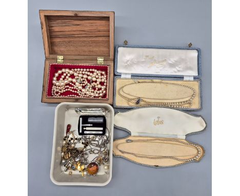 A Selection of costume jewellery; pendants, brooch, ring and faux pearl necklaces. 