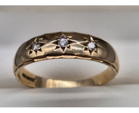 9ct yellow gold ring set with three round cut diamonds. [Ring size W] [2.80Grams] 