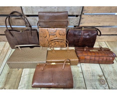 A collection of eight vintage Crocodile and lizard skin clutch hand bags; Mappin &amp; Webb hand bag, Simon Martin leather ha