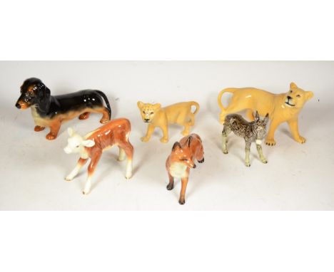 A collection of six pottery animal models, makers to include Beswick and Goebel. (6) 