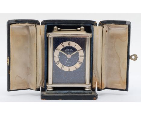 Looping, an 8 day stainless steel small alarm/carriage clock, with blue enamel dial, 7.5cm, travel case. 