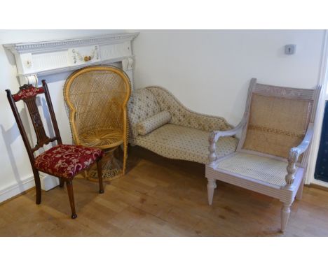 A floral upholstered chaise longue, 130cm, two wicker chairs with a mahogany hall chair, and a molded fire surround. 