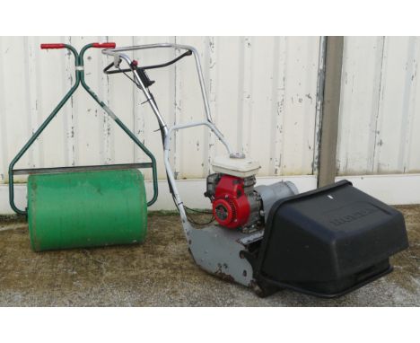 A Honda petrol driven lawn mower, model G100 2.2HP electronic ignition, together with a garden roller (2) 