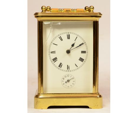 A French brass repeater carriage clock, the enamelled dial with Roman numerals, housing 8 day jewelled movement striking on g