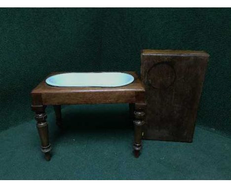 A mahogany footstool fitted a ceramic basin 