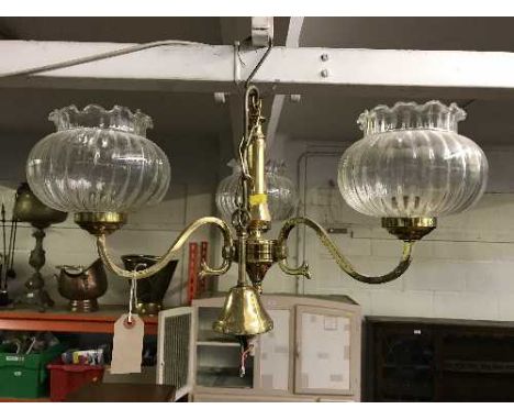 A pair of three way brass light fittings 