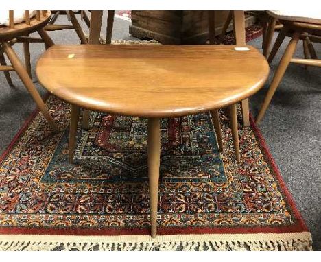 An Ercol light elm miniature flap-sided table 