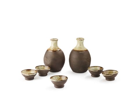  JANET LEACH (BRITISH 1918-1997) FOR LEACH POTTERY SAKE SET impressed maker's and pottery seals, stoneware, comprising two bo