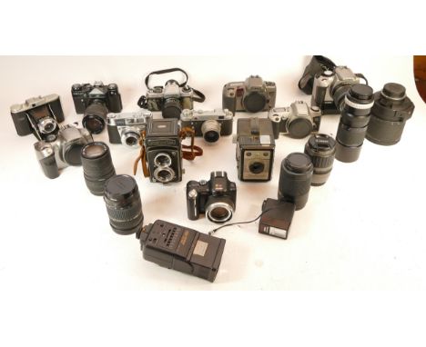 A collection of mixed cameras and accessories to include an Olympus Pen, a Zenit E and a Yashica Flex 