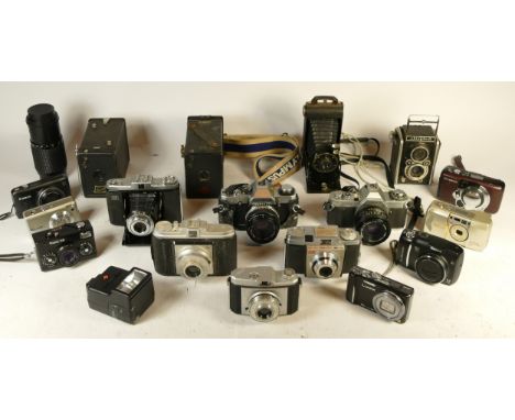 A collection of mixed cameras and accessories to include a Canon AV1, an AGFA Isola and an Olympus OM20 