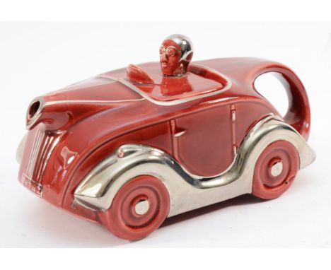 A mid 20th century Sadler ceramic novelty teapot in the form of a racing car with driver, registered No 820236, 