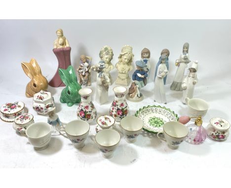A collection of porcelain and ceramic figurines, together with two Sylvac pottery models of rabbits, and other wares. 