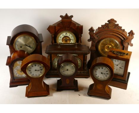 A collection of Edwardian mahogany and oak cased mantel clocks, having manual 8 day movements. 
