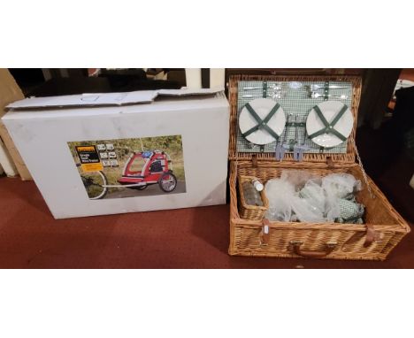 An Halfords child's bike/buggy trailer (boxed as new) together with a John Lewis wicker picnic hamper. (2) 