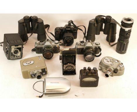 A collection of mixed cameras, binocluars and accessories to include a Super Zenith, Paragon and a Canon AE1 