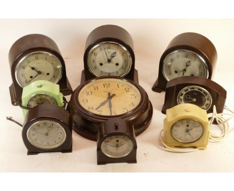 A collection of mid 20th century Smiths bakelite mantel and wall clocks, having manual and electric movements. 